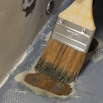 TotalBoat Polyester Finishing Resin being applied with a brush